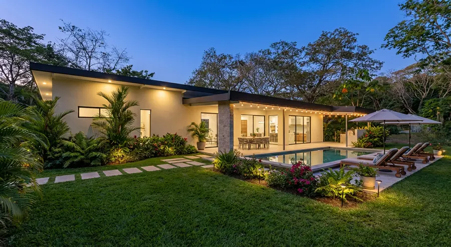Casa Valley villa in Playa Venao at dusk, with lit private pool and garden