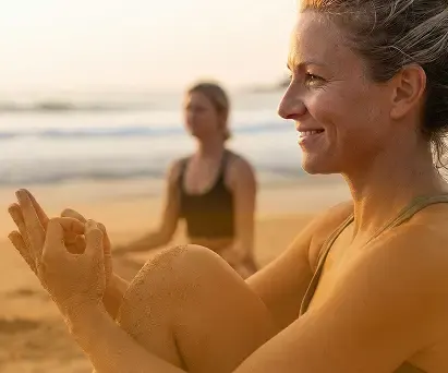 Women practising yoga on the beach at sunset in Playa Venao